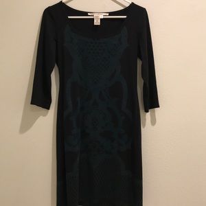 Quarter sleeve black dress with green design